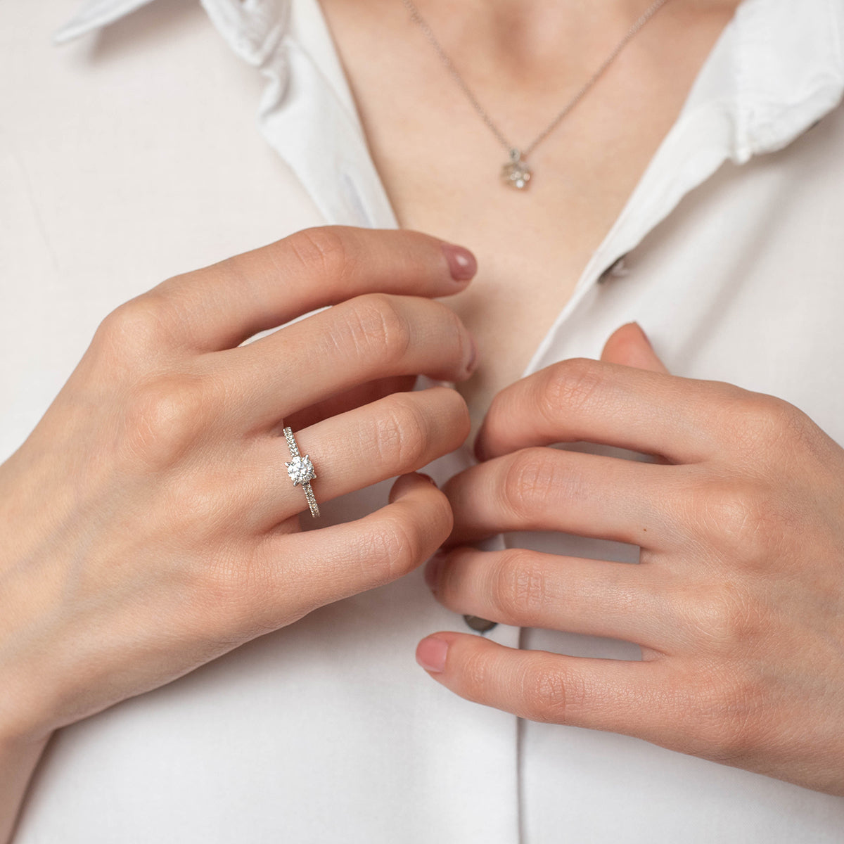 a person is holding a pair of scissors