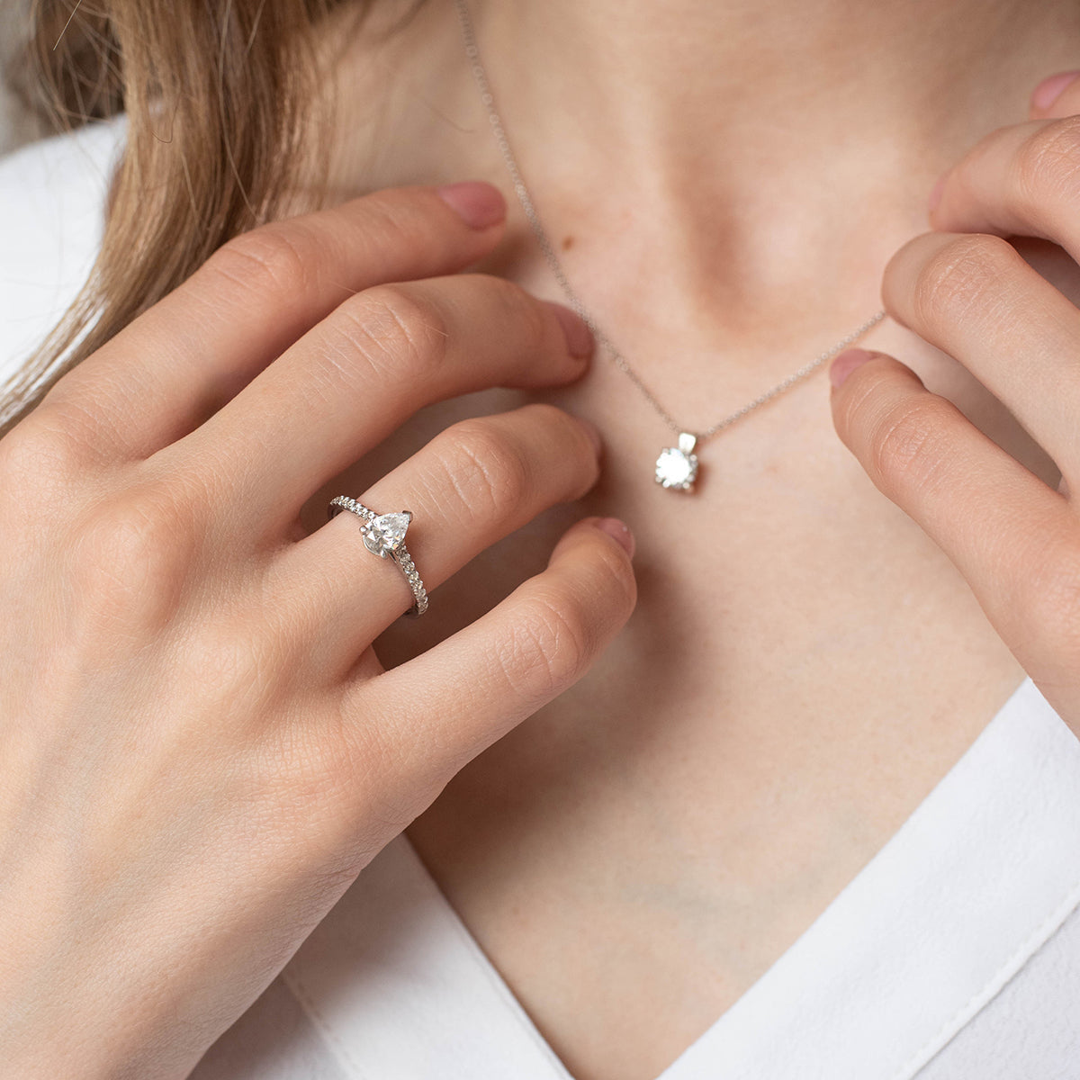 a close up of a person holding a pair of scissors