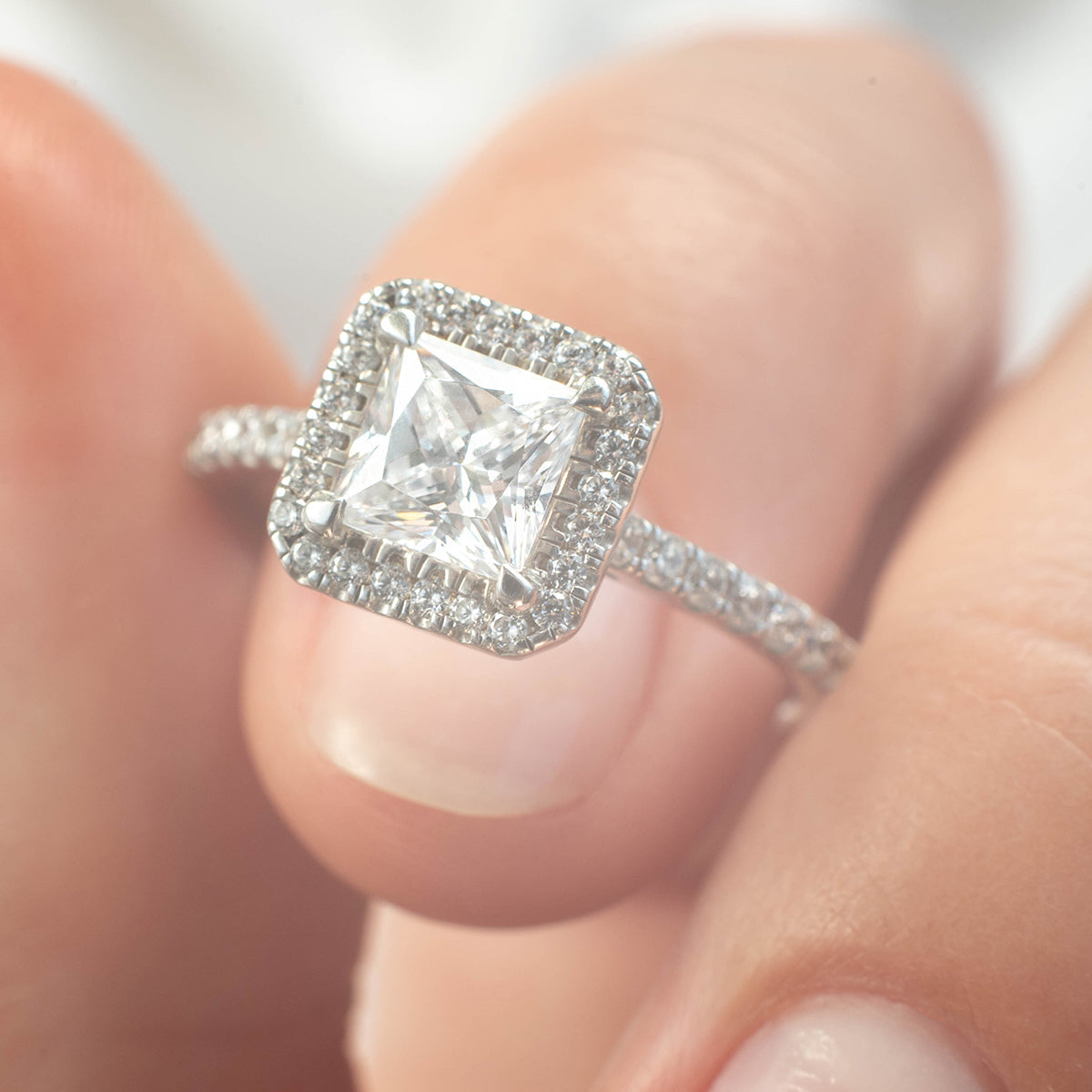 a person holding a cell phone in their hand