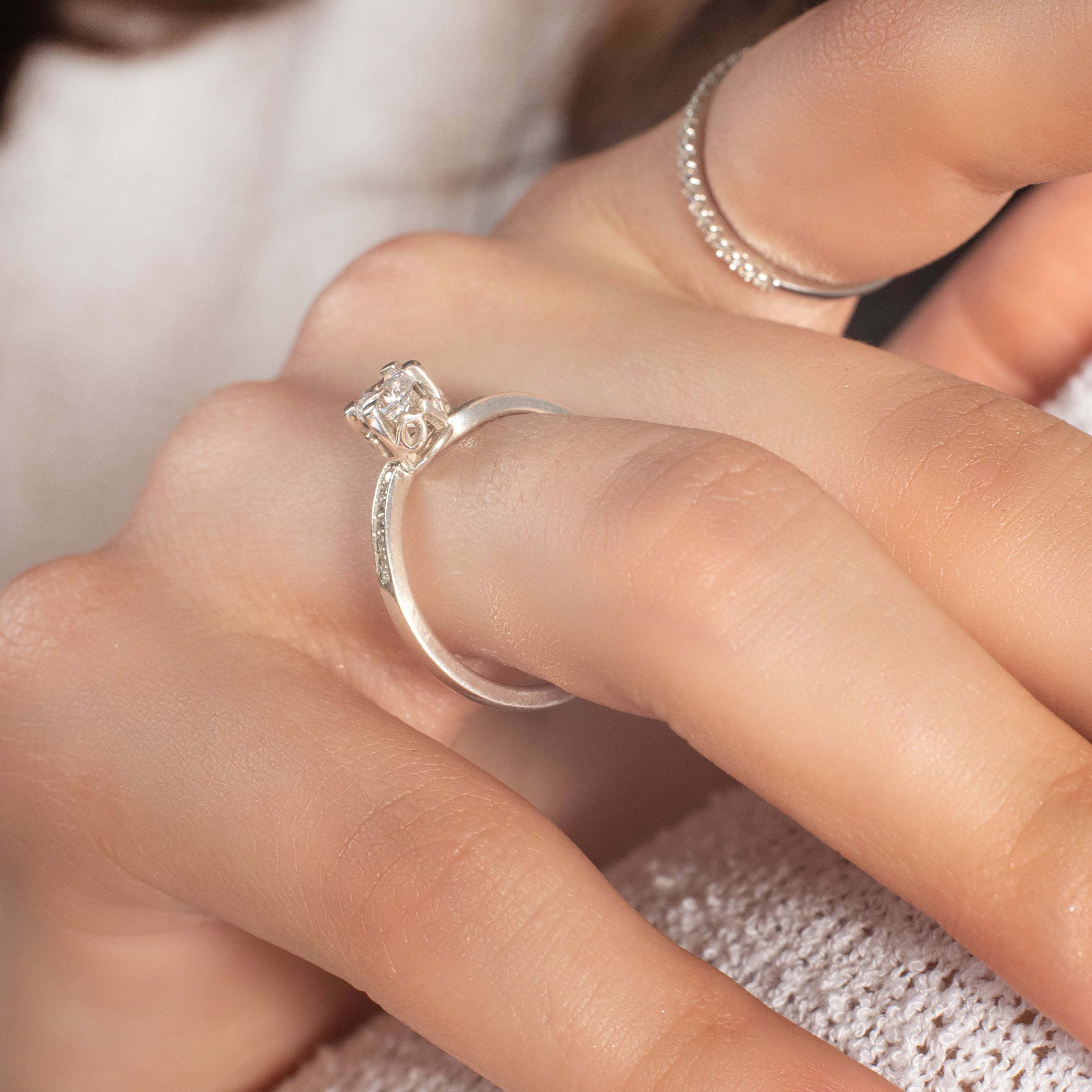 a close up of a person holding a pair of scissors