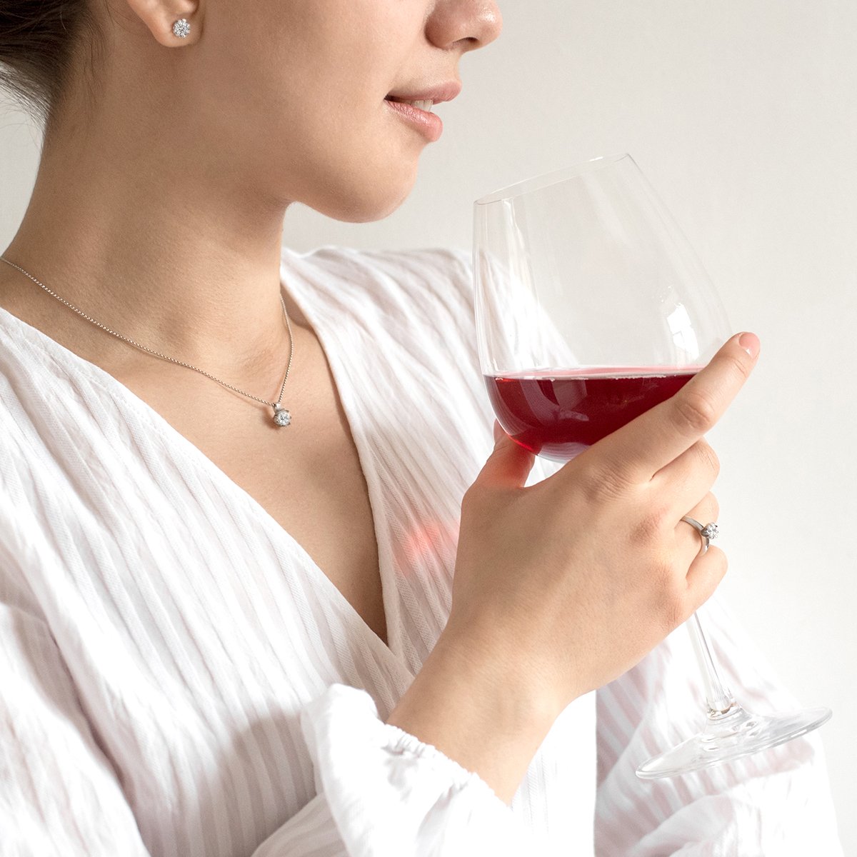 a woman wearing a white dress shirt and tie