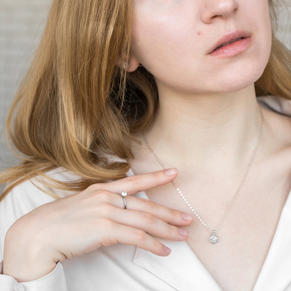 a young girl holding a cell phone to her ear