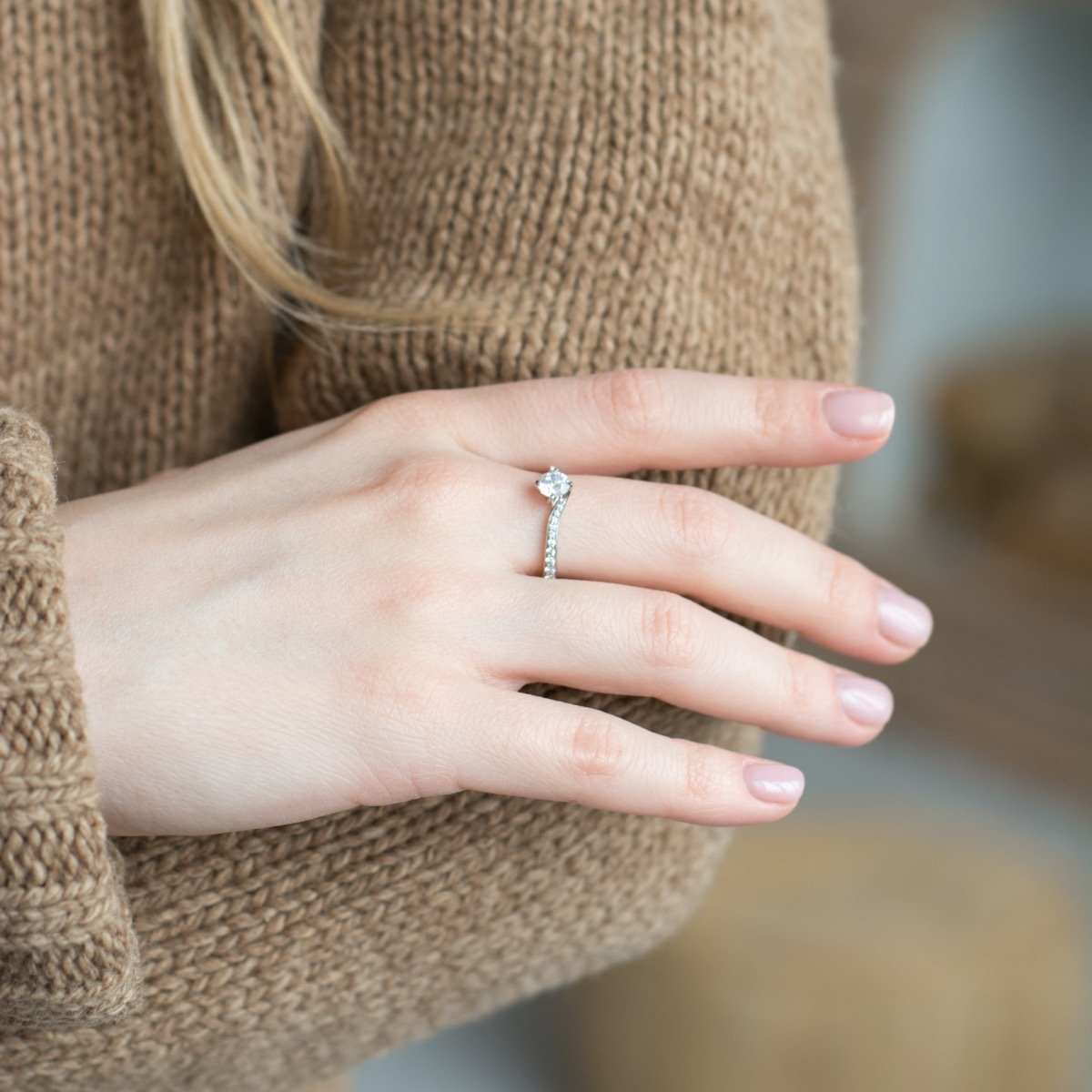 a person is holding a pair of scissors