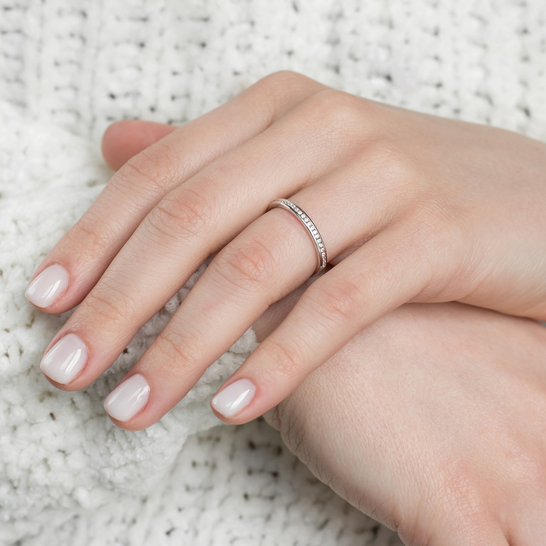 a person is holding a pair of scissors