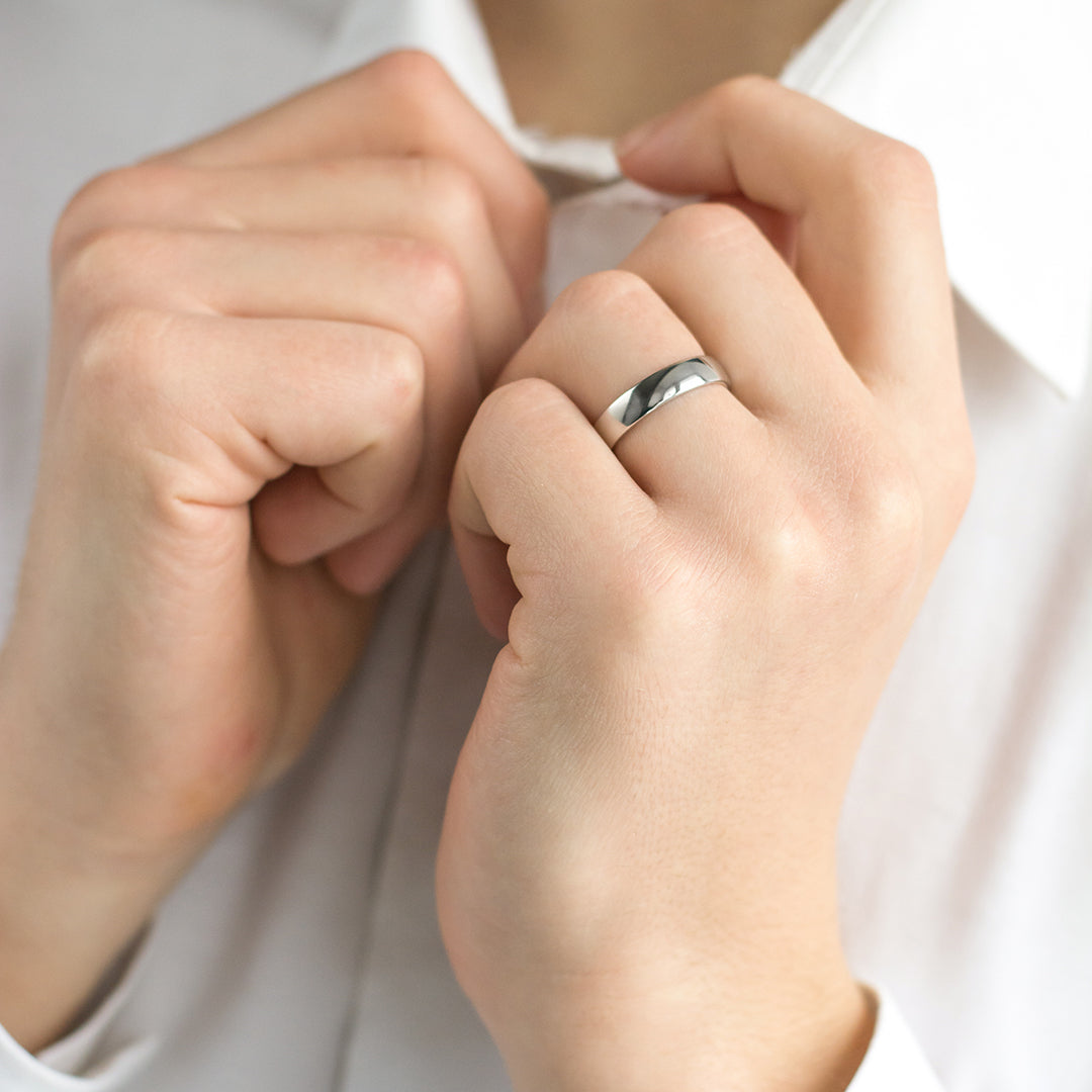 a person is holding a pair of scissors
