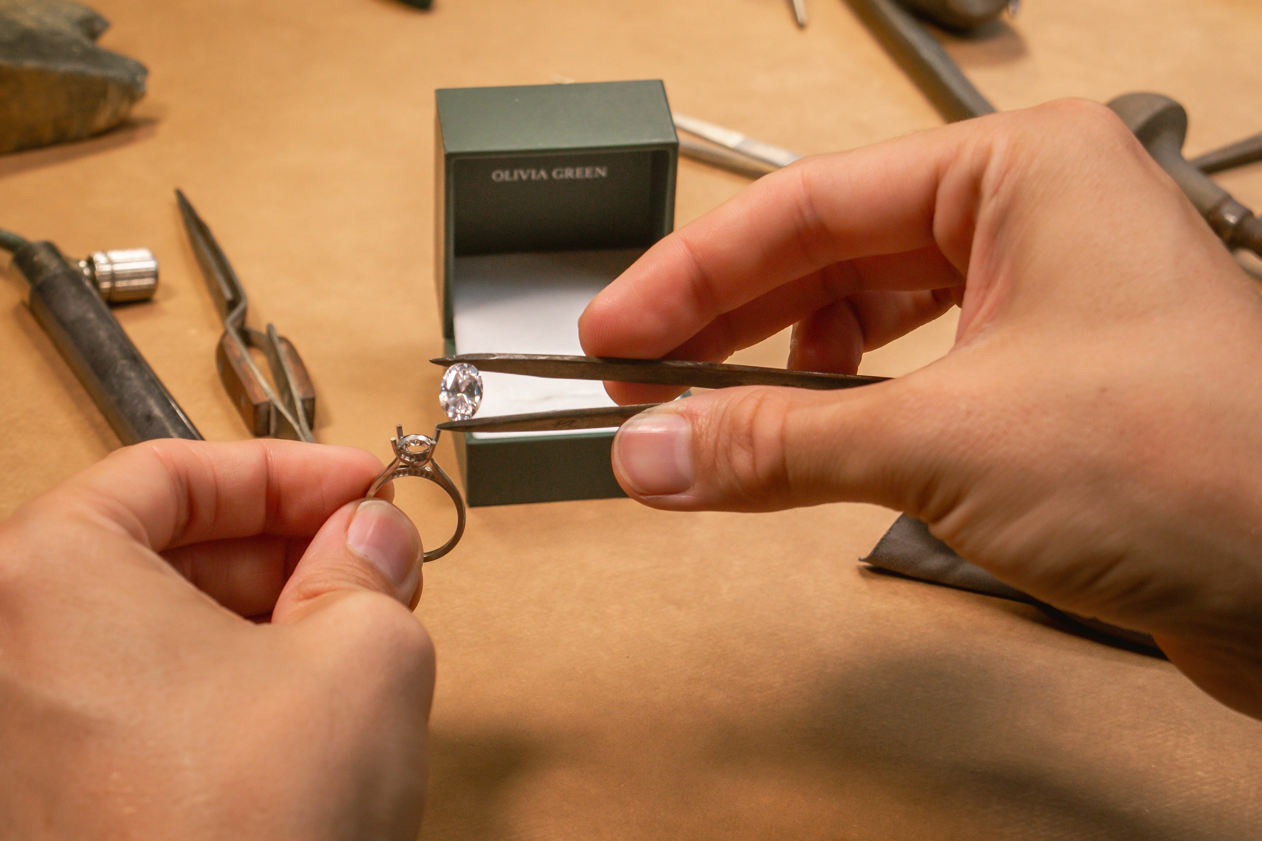 A designer’s sketchbook open to custom ring and necklace concepts