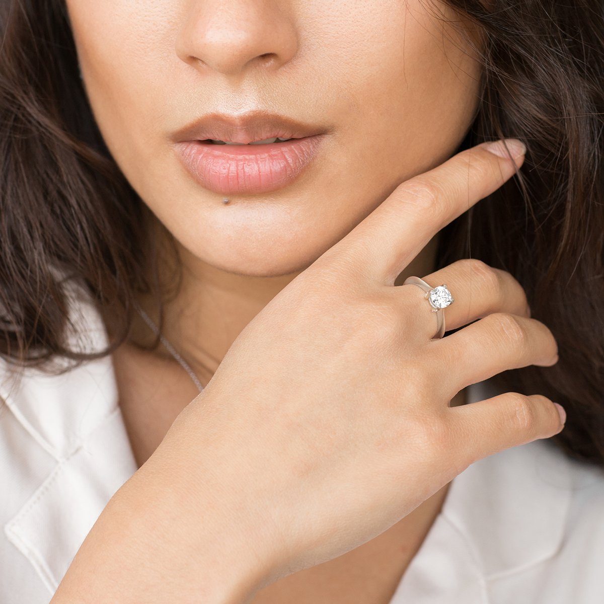 a close up of a person holding a cell phone 