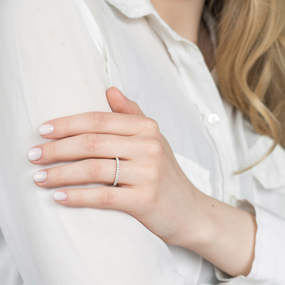 a woman holding a cell phone in her hand 