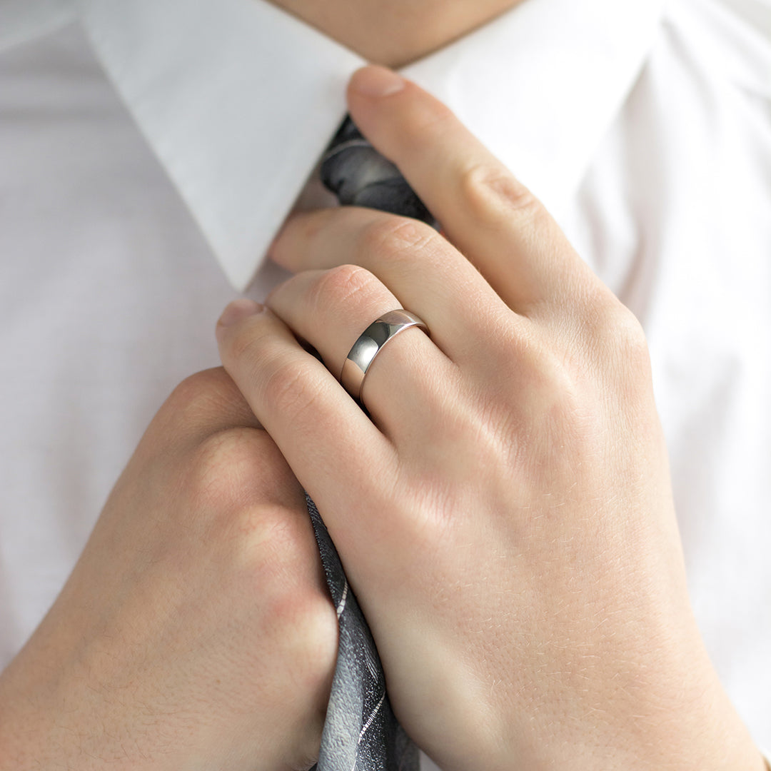 a man wearing a white shirt and tie 